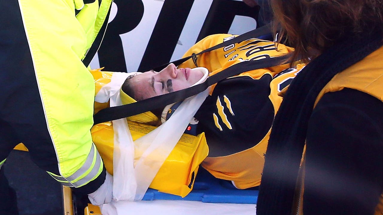 College hockey teams take to the ice in show of support for Denna Laing
